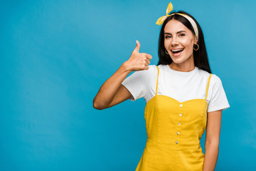 happy woman woman showing thumb up isolated on blue