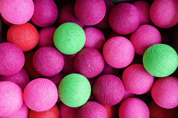 Cotton light balls in pastel colours used for decoration. Creative colorful background.