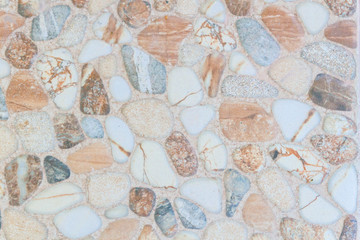 The texture of the colored stone in the form of tiles on the street