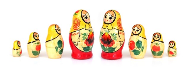 Traditional Russian wooden toy "Matryoshka" isolated on white background