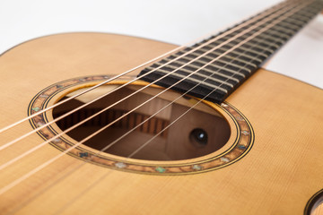 wood texture of lower deck of six strings acoustic guitar on white background. guitar shape