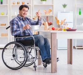 Disabled man preparing soup at kitchen