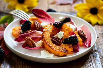 Autumn salad with roast pumpkin, chickory, pecans and goat cheese
