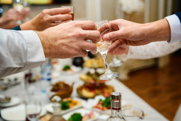 hands with glasses at shallow depth of field