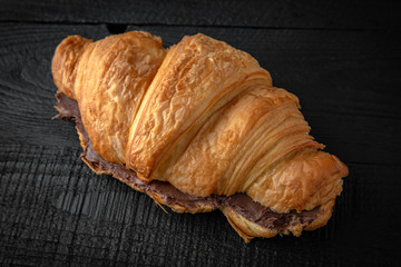 Croissant sandwich with hazelnut chocolate paste. Healthy, tasty, nourishing snack. Take away food