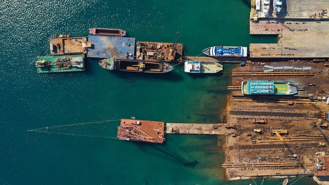Aerial photo of industrial old shipyard repairing small boats in Mediterranean port Stock Photo | Adobe Stock