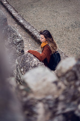 Young woman visiting Moorish Castle in Sintra, Portugal