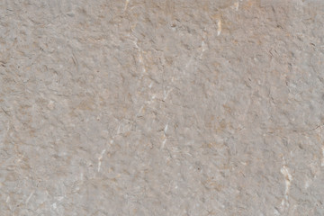 Cracked cement wall with beige structure