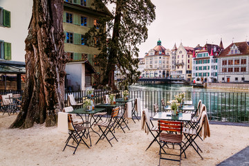 Old town street and restarurant tables in Lucerne city, Switzerland
