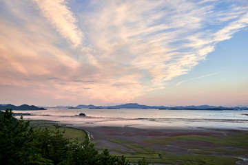 The view of beautiful clouds and the ocean at the Sunchoenman Bay Wetland Reserve in South Korea.