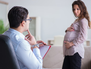 Pregnant woman visiting psychologist doctor