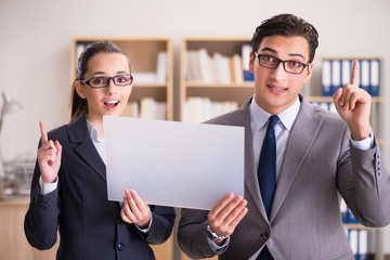Businessman and businesswoman having discussion in office