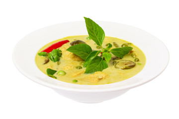 Closeup plate of thraditional thailand meal - green curry with chicken and eggplants served in a plate isolated at white background.