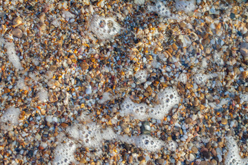 sea pebbles colored granite on the beach