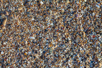 sea pebbles colored granite on the beach