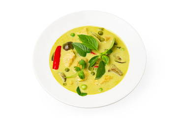 Closeup plate of thraditional thailand meal - green curry with chicken and eggplants served in a plate isolated at white background.
