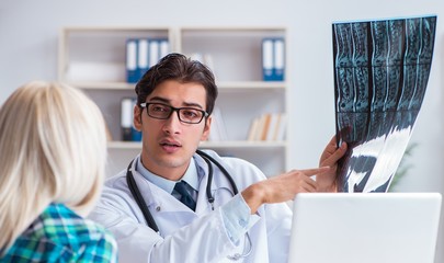 The doctor examining x-ray images of patient