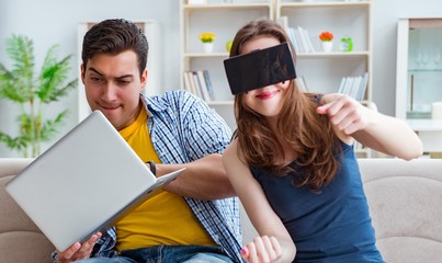 The young family playing games with virtual reality glasses