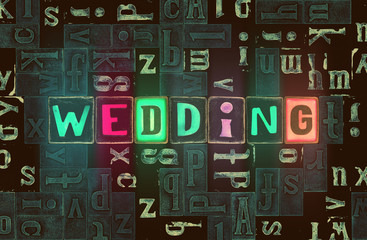 The word Wedding as neon glowing unique typeset symbols, luminous letters wedding