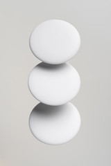 top view of white badge on white background