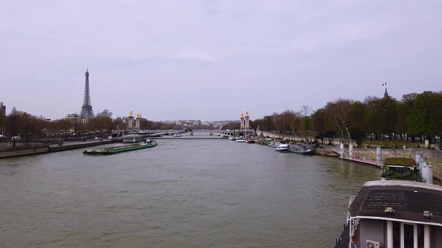 River Seine with Eiffel Tower in Paris city at spring or autumn day. Royalty free Full HD stock footage related to France, French and European life, people, travel, culture, business. 