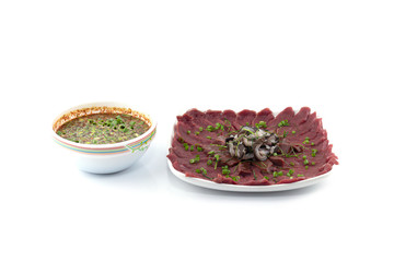 Sliced ​​Fresh beef with thai sauce isolated on white background