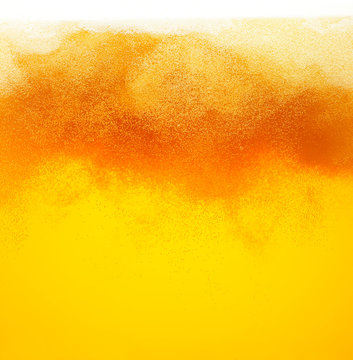 Close up background of beer with bubbles in glass