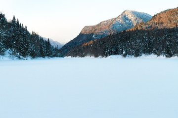 winter in the valley: mountain, river covered in snow. Jacques-Cartier Valley National Park, Quebec, Canada