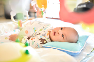 4 Month old Cute little Asian baby playing Playgym