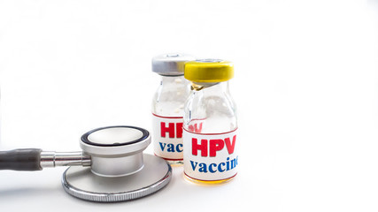 Stethoscope  and two bottles of vaccines 