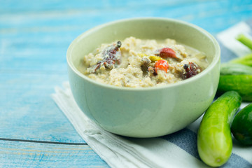Herbed soya beans with minced pork in coconut milk served in white bowl