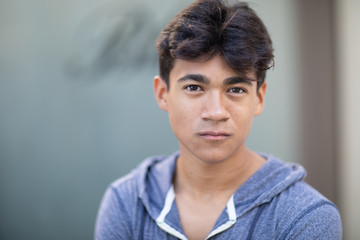 Portrait of a handsome Asian young man next to the blurred background