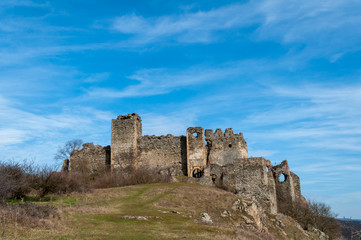 Fototapeta premium A view of Soimos Fortress with a blue sky in the background. Built in 1278