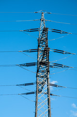 pylon of an overhead powerline with insulators and cables