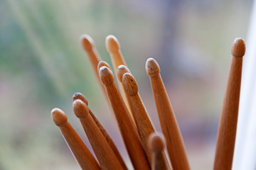 lots of drumsticks in the window with blur in the background