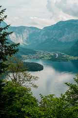 Landscape photo of blue lake green land and mountains