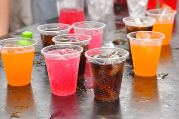 Colorful soft drink in plastic cup