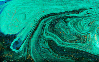 Green and gold marbling pattern. Golden powder marble liquid texture.