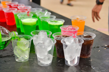 Colorful soft drink in plastic cup
