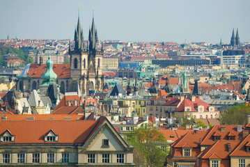 Naklejka na ściany i meble April sunny day over the roofs of old Prague. Czech