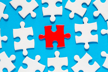 One red with white jigsaw puzzle pieces