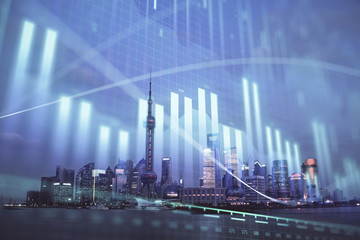 Forex chart on cityscape with tall buildings background multi exposure. Financial research concept.