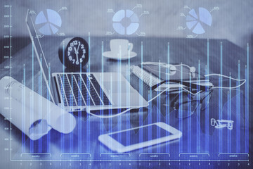 Double exposure of forex graph and work space with computer. Concept of international online trading.