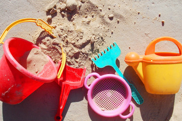 Fototapeta na wymiar sandbox. Kids toys. bucket. shovel. rake. watering can. sieve. summer. sand. background 