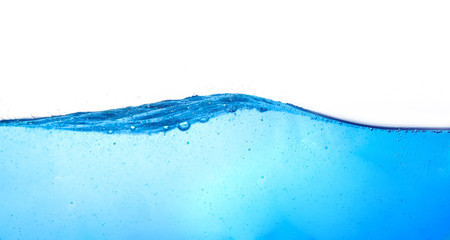 blue water surface with splash, waves and air bubbles on white background