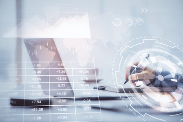 Multi exposure of forex chart with man working on computer on background. Concept of market analysis.