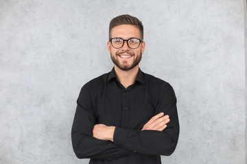 Attractive man dressed casual, wearing glasses - studio shot, copy space