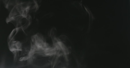 water mist over black background