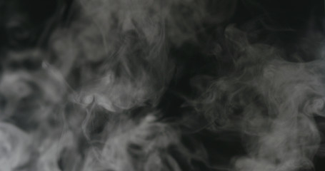 water mist over black background