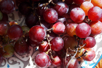 grapes on a plate. autumn.mall. background          